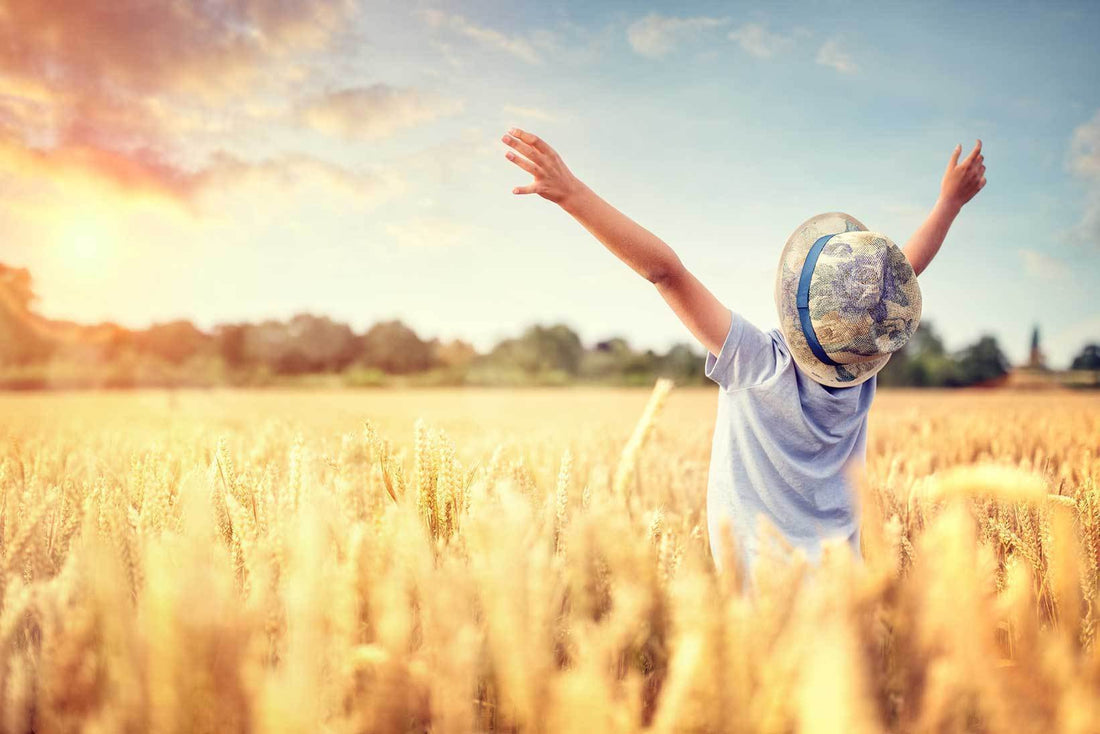 Child standing outdoors in a field