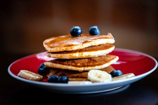 Nutritious School Lunch Pancakes with blueberries and bananas.