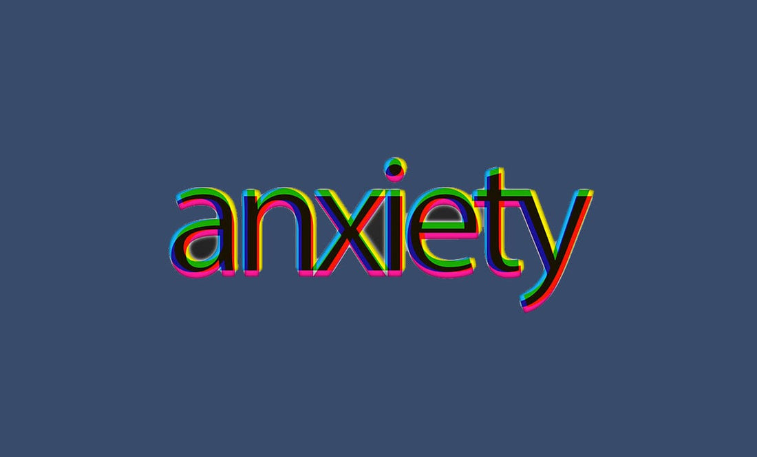 Anxiety word in neon against blue/black